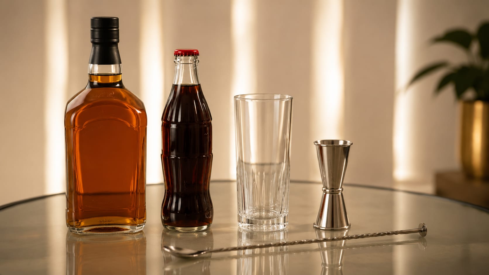 Ingredients and tools to make Whiskey Coke